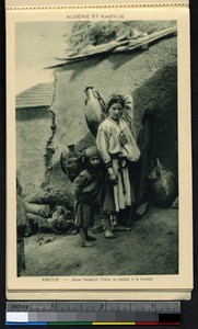 Young woman and young girl going to the fountain, Kabylie, Algeria, ca.1900-1930