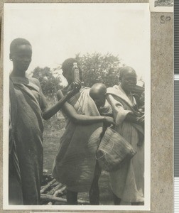 Patient with a medicine bottle, Eastern province, Kenya, ca.1949