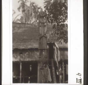 A female hampatong with sucking child stands above a Kamba (ghost) on the Hampatong River in Tadjugan