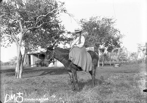 European woman riding a horse, Mozambique, ca. 1896-1911