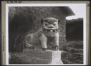 A stone lion which is supposed to keep evil influences from the house