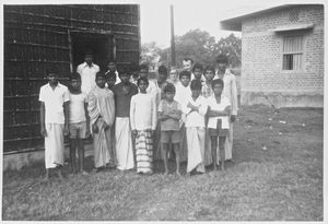 Bangladesh, Chapai Nawabganj. Kirsten and Jens Vestergaard with hostel boys outside the "Readin