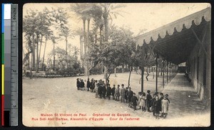 Orphans standing in line near the school, Alexandria, Egypt, ca.1900-1930