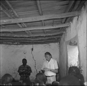 Rev. Jacques Maury reading the Bible