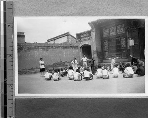 Harwood Bible Training School students with children in village, Fenyang, Shanxi, China, 1936