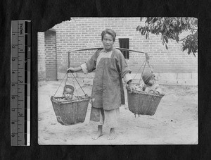 Children carried in baskets, Fujian, China, ca.1911-1913