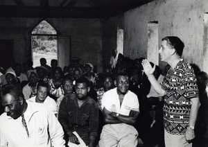 M. Haines, member of the World Council of Churches (WCC) is speaking to native people in a church of the bush