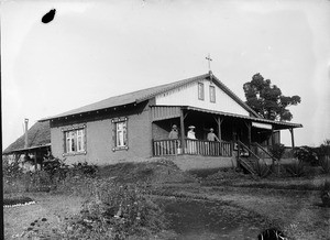 Missionaries posing on a veranda, Tanzania, ca.1893-1920