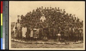 School photo taken on a giant termite mound, Kongolo, Congo, ca.1920-1940