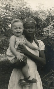 European child with an african woman, in Gabon