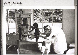 Manyemen. Dr Ode is examining a child for leprosy