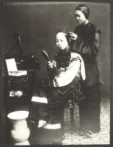 Elegant chinese woman with her maid