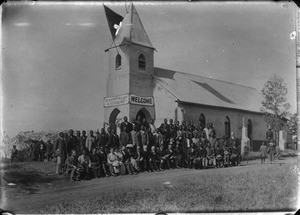 Swiss missionaries and African people in front of a chapel, South Africa, ca. 1880-1914