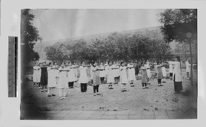 Girl students exercising with weights, Beijing, China, 1910