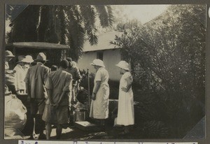 Loading a truck, Machame, Tanzania, ca.1930-1940