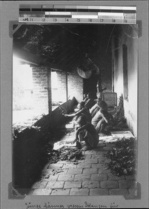 Young men pressing plants, Nyasa, Tanzania, ca.1898-1914