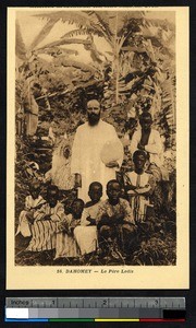 Missionary father poses with seven boys, Benin, ca. 1900-1930