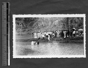 Baptismal service at river during Shantung Christian University retreat, Shandong, China, 1936