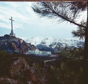 Cross above white building