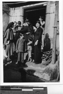 Maryknoll Sister visiting a home at Meixien, China, 1940