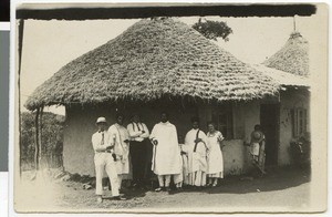 Group portrait in front of Hermann Grabe's house at the mission station, Bedele, Ethiopia, 1933