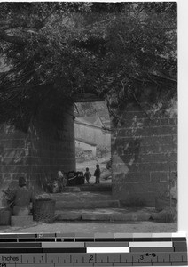 Stone gate opening to early Kowloon, China, 1928