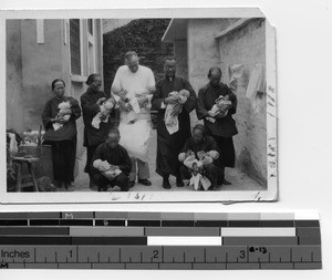 Fr. Toomey and Catholic family in Guilin, China, 1942