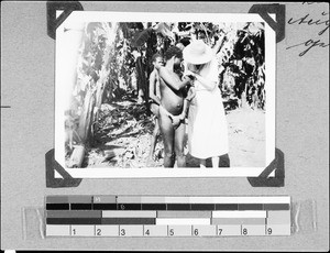 Mrs. Waldner helping a baby, Nyasa, Tanzania, 1935