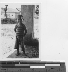 A boy greets Maryknoll priests at Meixien, China, 1934