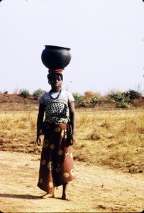 Woman with water jar on her head, Cameroon, 1953-1968