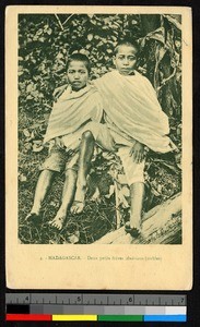 Two young noble boys sitting together outdoors, Madagascar, ca.1920-1940