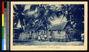 Village palisade encircling thatch-roofed houses, Madagascar, ca.1920-1940