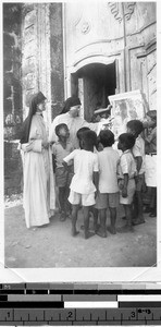 Sisters Patricia Marie and Maria del Ray teaching catechism, Malabon, Philippines, ca. 1940