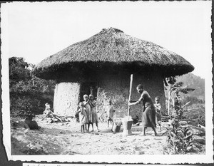 Woman stamping maize, Pare, Tanzania, ca.1927-1938