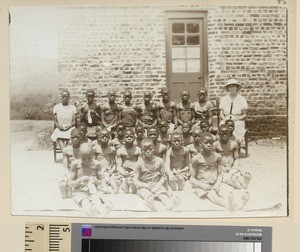 Sewing teacher and class, Mihecani, Mozambique, ca.1925