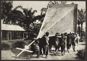 Building the church in Iabassi, Cameroon, in 1922. The christians carry the