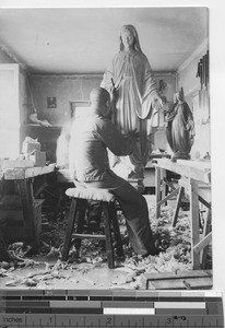 A wood carver at industrial Workshop at Fushun, China, 1936