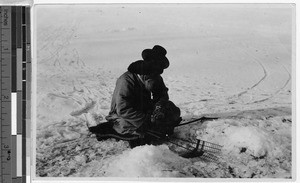 Man ice fishing, Korea, ca. 1930-1950