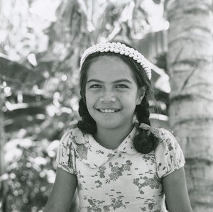 A polynesian girl with a crown of cowries