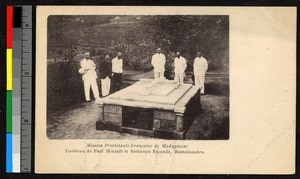 Men standing around a low stone tomb, Madagascar, ca.1920-1940