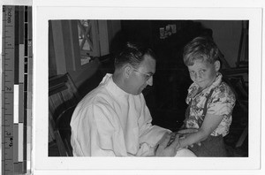 Board of Health doctor administering tuberculous test, Honolulu, Hawaii, ca. 1940