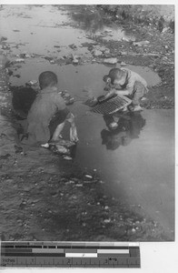 Little boys doing laundry at Fushun, China, 1937