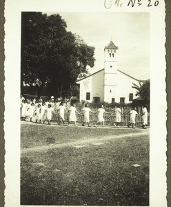 Blind girls leave the church in Moiyen