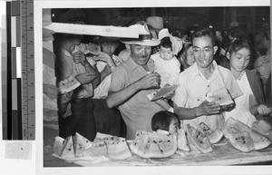 Internees eating watermelon at Granada Japanese Relocation Camp, Amache, Colorado, July 10, 1943