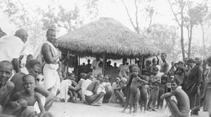 Vaipur, Tirukoilur District, South India. The lepers' Hut, waiting area and meeting place. Peop