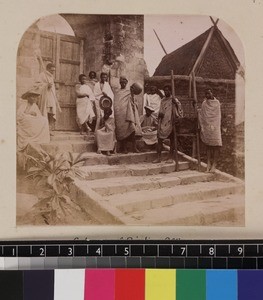 Indigenous printing workers gathered around gateway of printing office, Madagascar, ca. 1865-1885