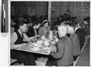 Evacuees from Seattle enjoying a meal, Puyallup, Washington, July 1942