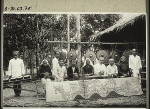 Priests and priestesses at a funeral celebration above Sampit