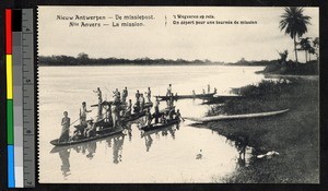 Men poling boats along a riverbank, Congo, ca.1920-1940