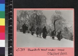 Travelling across countryside under snow, Yunnan, China, ca. 1920